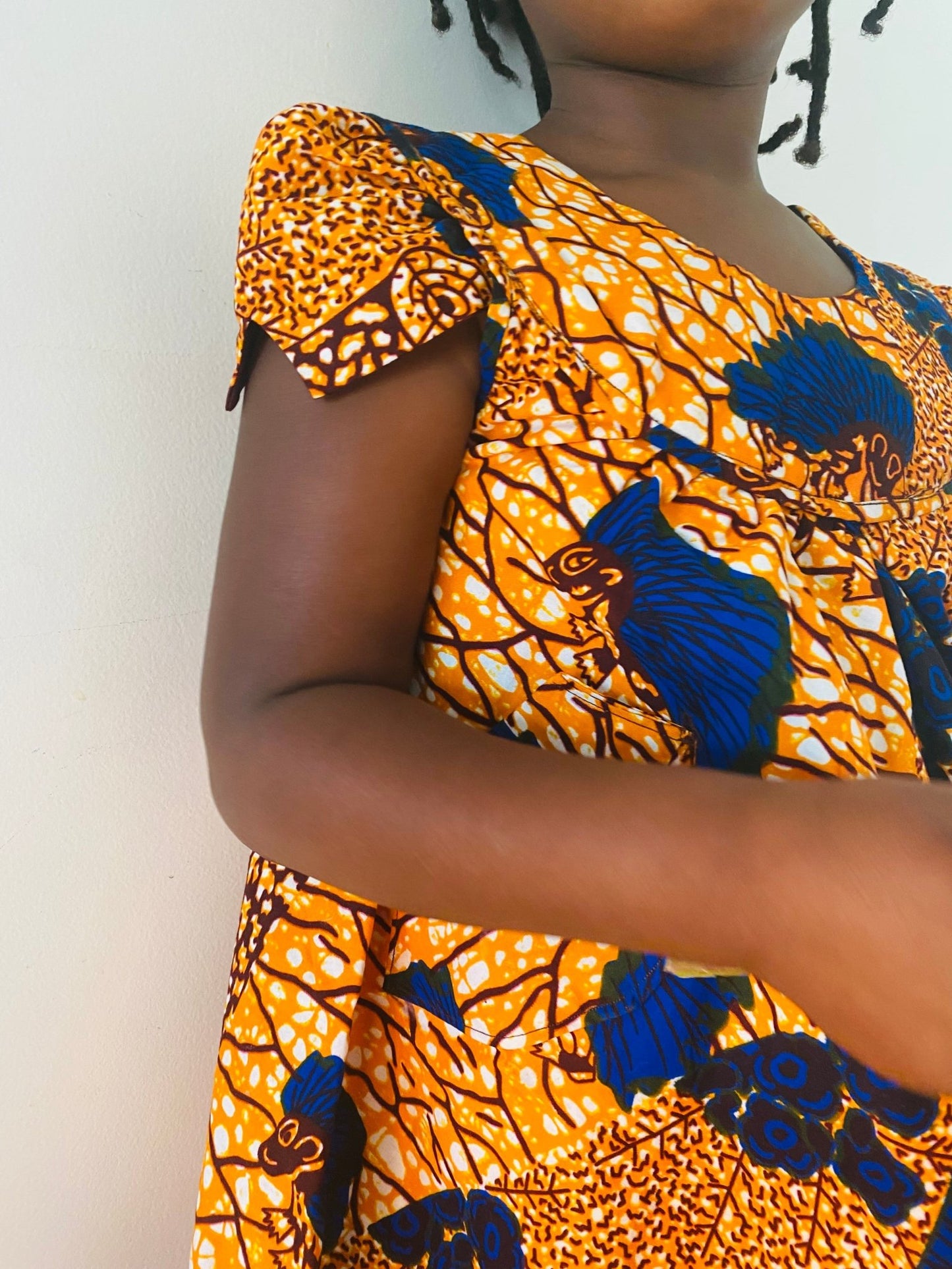 Robe enfant orange en wax fleurie - Kaysol Couture