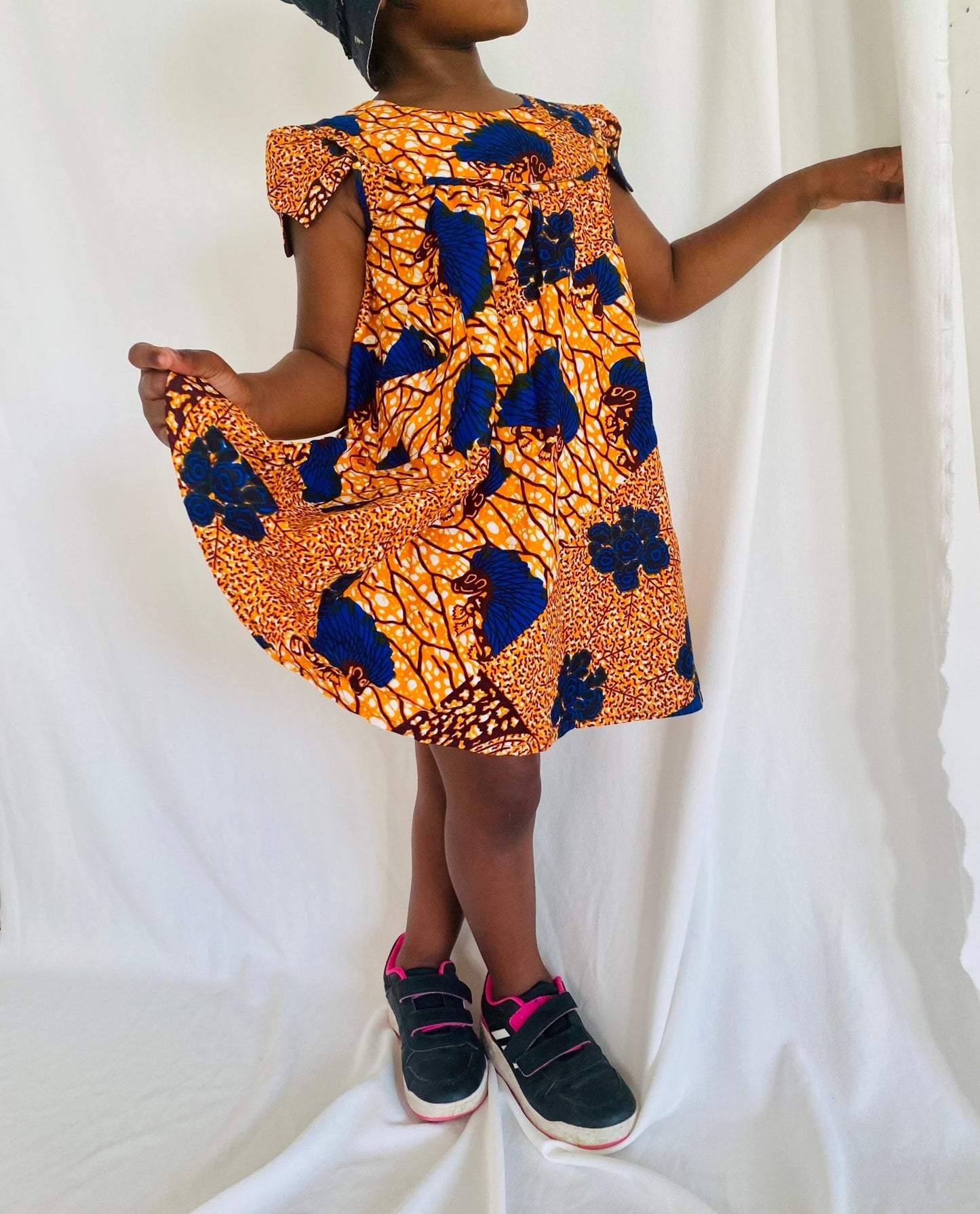 Robe enfant orange en wax fleurie - Kaysol Couture