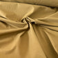 Gabardine 100 % coton kaki clair vendue au mètre. Tissu dense et résistant (240 g/m²), idéal pour pantalons, vestes et projets couture.